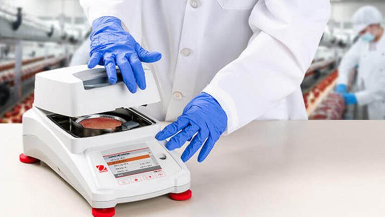 ohaus mb120 moisture analyzer used by lab technician